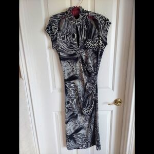 Sheath dress with cutouts in the front and back. Size L.